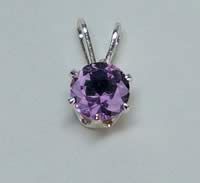 A purple stone set in a Snap-Tite setting.